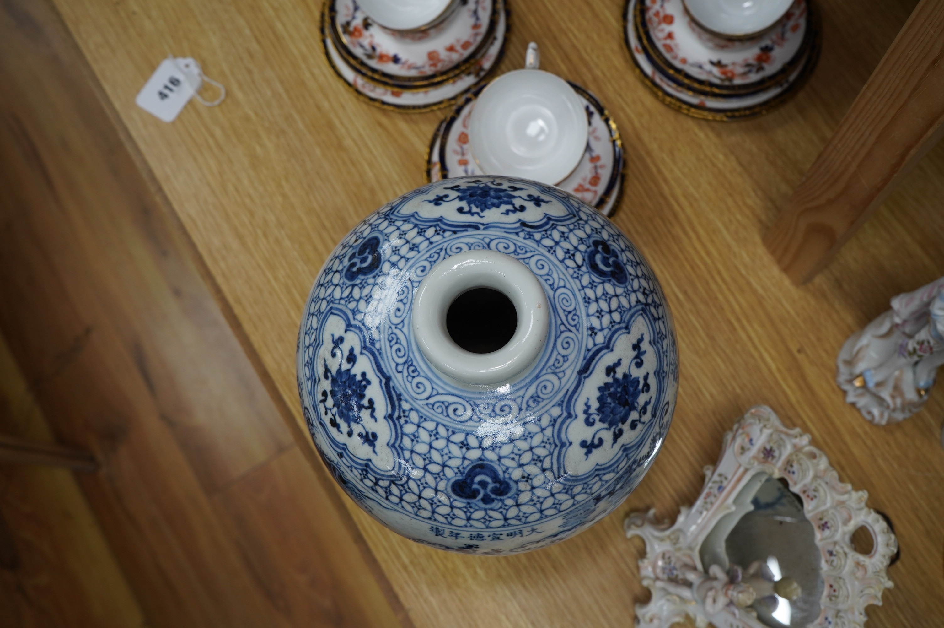 A Chinese blue and white vase, decorated with figures before a landscape, 31cm high. Condition - good